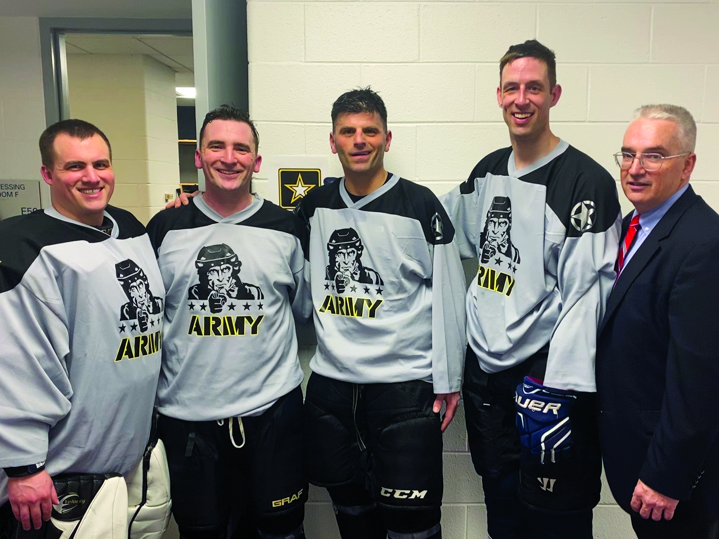 The JAG Corps was once again well-represented at the annual Army-Navy Hockey game played at Capital One Arena in Washington, DC. From left to right: CPT Marc Emond (Government Appellate Division, USALSA), CPT Alex Boettcher (Fort Belvoir OSJA), MAJ Jack Einhorn (Defense Appellate Division, USALSA), SSG Michael Crocker (151st LOD), and COL (Ret.) Mike Mulligan. In a fairly physical matchup, all attorneys and paralegals escaped the game with no black eyes or lost teeth, and there were only two penalties attributed to the group. Surprising to no one who knows him, both penalties (roughing, goaltender interference) were simultaneously given to CPT Boettcher.